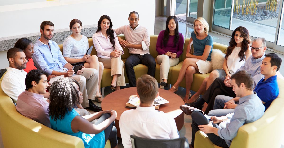 Large team meeting on a sofa
