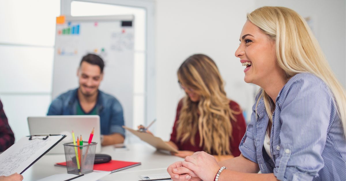 Person smiling in team meeting